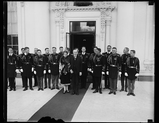 Grace Coolidge and Calvin Coolidge and military group outside White House, Washington, D.C.