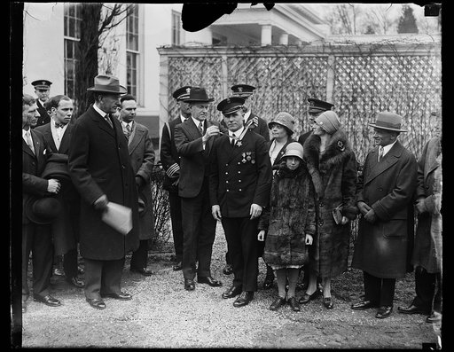 Calvin Coolidge and star recipient outside White House, Washington, D.C.