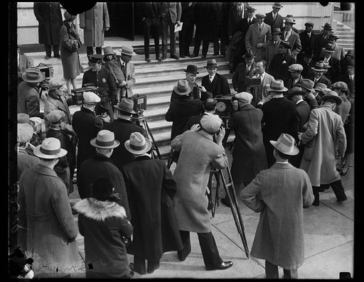 Cameramen charge John D. Rockefeller, Jr., as he leaves U.S. Capitol. John D. Rockefeller, Jr., facing a battery of cameramen at the Capitol in Washington today after testifying before the Senate Public Lands Committee investigating the Teapot Dome leases