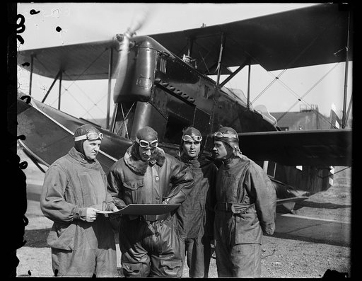 Assistant Secretary of War completes final plans with pilots for long air trip to Panama. Final plans were completed at Bolling Field, Washington, today for Assistant Secretary of War F. Trubee Davison, who will start on his long flight to Panama at daylight Sunday, March 11th. In the photograph, to