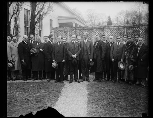 Group outside White House; Calvin Coolidge and Dwight Davis at center. Washington, D.C.