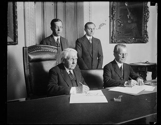Frank Kellogg at desk