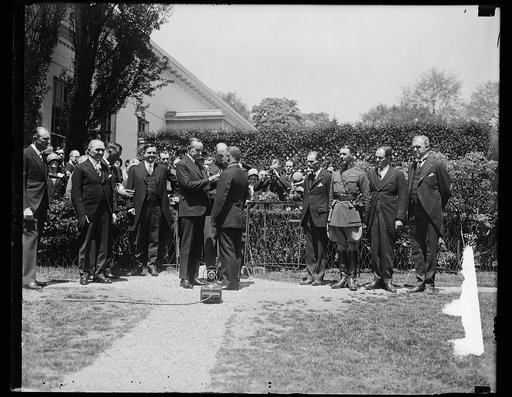 President Coolidge receives winners of essays on safety lesson. The winners in the national safety lesson essay contest conducted by the Highway Education Board were received by President Coolidge today. In the center of the photograph, left to right: Rep. W.W. Arnold of Illinois; Senator Charles S.