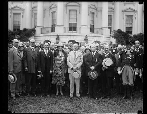 Members of the National Society Sons of the American Revolution were received by President Coolidge at the White House today. In the center of the group, left to right: Ganson Depew of Buffalo, N.Y., Mrs Ernest Rogers; Gorton Rogers; President Coolidge; Ernest Rogers, President General of the Societ