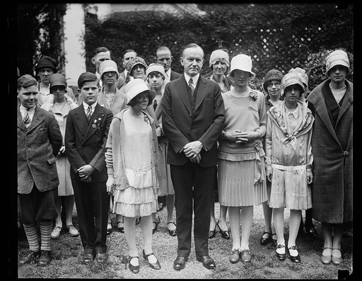 President Coolidge and Betty Robinson of South Bend, Indiana, winner of the fourth annual National Spelling Bee in Washington. The spelling bee contestants were received by President Coolidge at the White House today