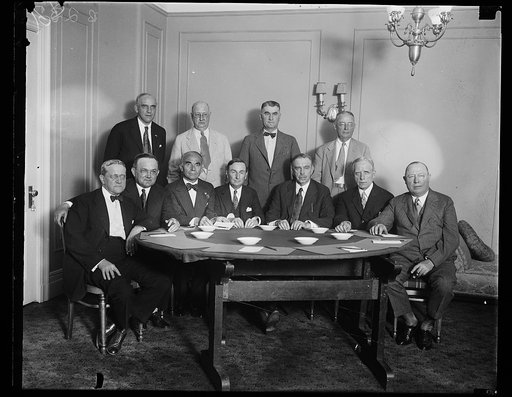 Group at table; included Hubert Work, 4th from right
