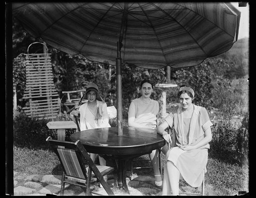 Young women seated at outdoor table