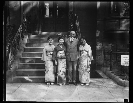 Man with Japanese women wearing kimonos