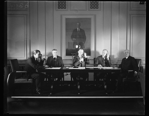 Calvin Coolidge and group on telephones