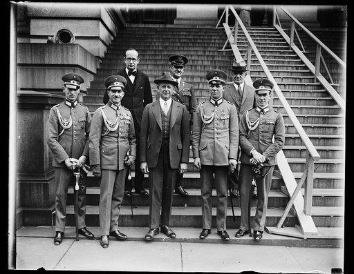 German cavalry horse show team received by Secretary of War Davis. Members of the German cavalry horse show team, one of the five foreign teams to compete with the United States in the 1928 National Horse Show just ended in New York City and the first German horse show team to come to the United Sta
