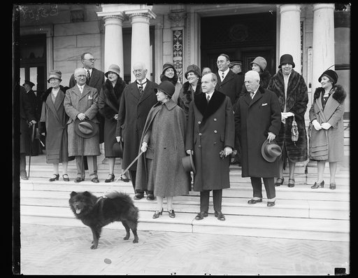 ...] (s) Chief Executive absent for Thanksgiving day. President and Mrs. Coolidge were absent from the White House for this year's observence of Thanksgiving. They journeyed to the Swannaoa Club, near Charlottesville, Va. This picture was made on the steps of the country club. On the left of the Pre