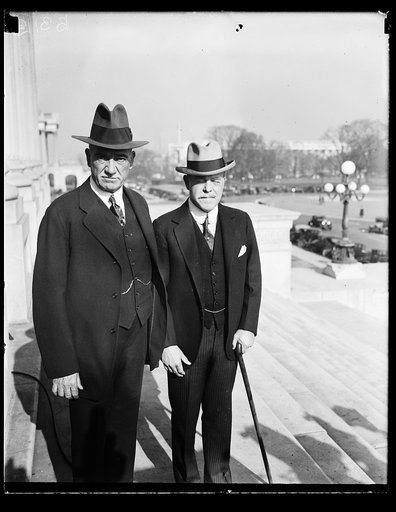 At opening of short session of 70th Congress. Speaker Nicholas Longworth of the House of Representatives (right) and Rep. John Q. Tilson of Connecticut, Republican floor leader of the House, were among the first to arrive for the opening the short session of the 70th Congress today