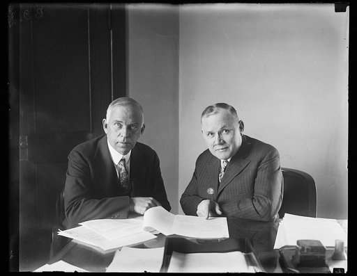 Discussing nationwide campaign for the prevention of blindness. Lewis H. Carris, (left) Managing Director of the National Society for the Prevention of Blindness, and William Green, President of the American Federation of Labor, discussing the nationwide campaign for the prevention of blindness and 