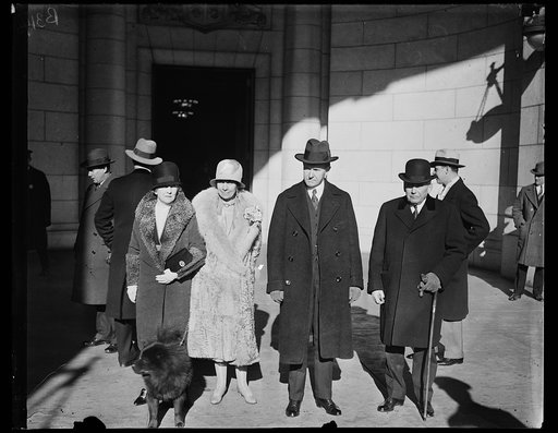 President and Mrs. Coolidge as they arrived at the Union Station, Washington today from their holiday on Sapelo Island, Ga. In the group, left to right, Mrs. Kellogg, wife of the Secretary of State, Mrs. Coolidge, President Coolidge, Secretary Kellogg