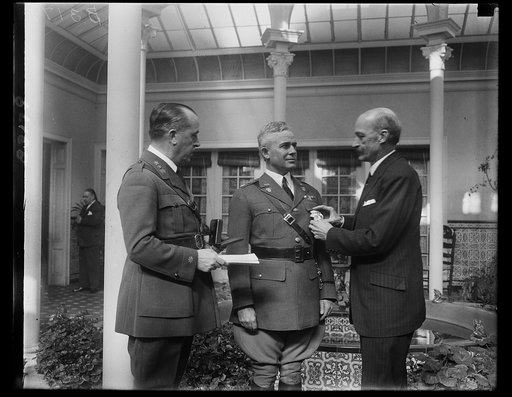 Commandment of West Point Cadets is decorated by Spanish Ambassador to U.S. Lieut. Col. Campbell B. Hodges, Commandment of Cadets at West Point, being decorated with the Spanish Military Cross of Merit by Ambassador Padilla today. Col. Hodges received the decoration for his service at the American E