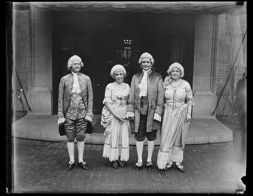 People wearing colonial costumes