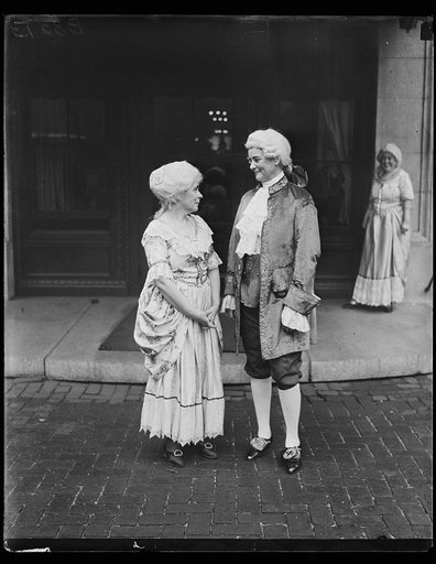 People wearing colonial costumes