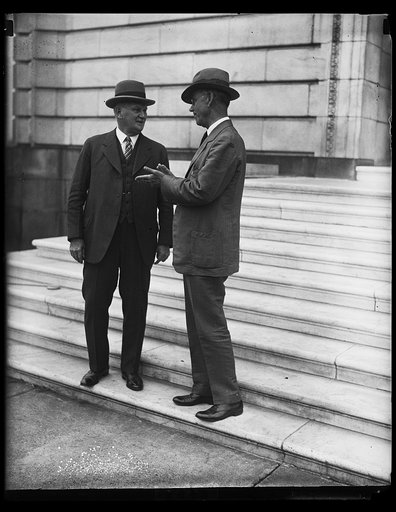 Representative Willis G. Hawley of Oregon, left, and Senator [...] Smoot, authors of the Tariff Revision Bill shown on the steps of the Senate Office building