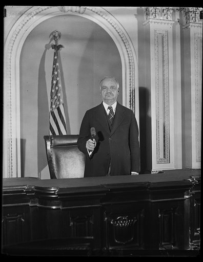 The Vice President makes ready for extra session. Vice President Curtis, standing in the ? of the Senate Chamber ready to open the extra session of the 71st Congress. Many important issues are to come up for discussion, and it is expected that will be a very busy session