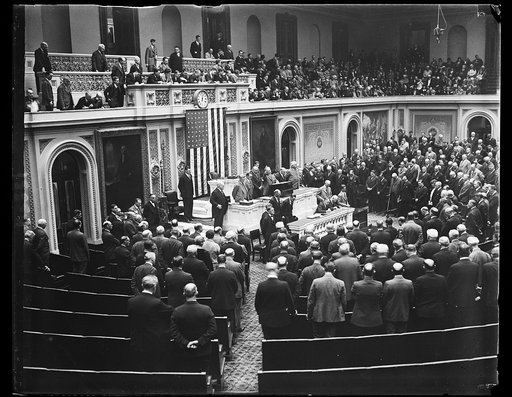 Covering of extra session of Congress, scene in the House of Representatives today when Congress convened for special session called by President Hoover. The chaplain of the House Roy James Shera Montgomery, is shown delivering the opening prayer