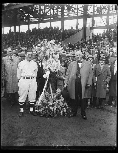 On behalf of the Elks of Washington, Joe Judge, captain of the Washington Baseball Team, was presented with a beautiful floral tribute today by Judge Robert E. Mattingly before the start of the first game