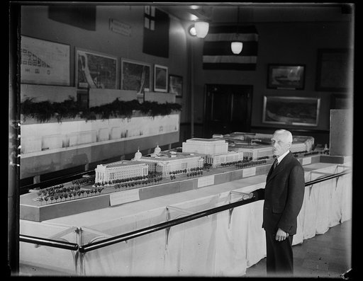 Secretary of Treasury Mellon and model of showing new buildings Uncle Sam will erect. Secretary of the Treasury Andrew W. Mellon, who is chairman with the responsibility for the new government building Uncle Sam will erect in Washington and which will make the National Capital the finest Capital in 