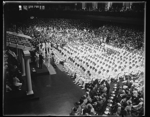 Secretary of Navy presents commissions to graduates of U.S. Naval Academy. Secretary of the Navy Charles Francis Adams awarding the diploma to 239 members of the graduating class at the United States Naval Academy in Annapolis, Md., today