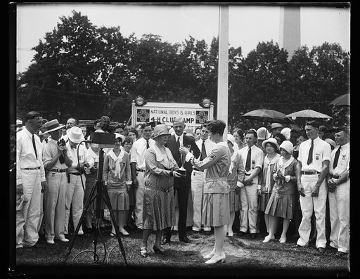 Mrs. Hoover presents cup to boy winner at National 4-H Club Camp. Mrs. Hoover presenting to John C. Jackson of East Baton Rouge Parish, Baton Rouge, Louisiana, the cup known as the Secretary of Agriculture Trophy, at the National Boys' and Girls' 4-H Club Camp held on the grounds of the Department o