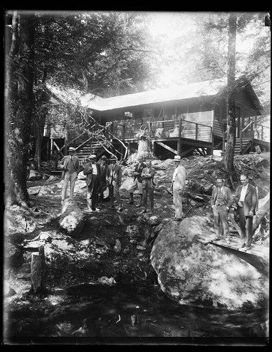 Group at cabin in forest
