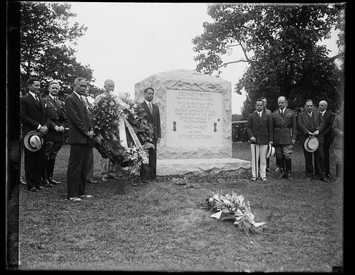 Group at gravestone of Leonard Wood