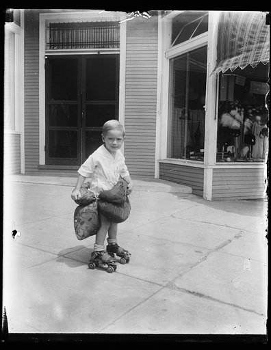 Boy on rollerskates with pillows