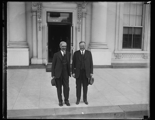 The big duo. Just before leaving for the presidential camp on the Rapidan, President Hoover and Premier MacDonald posed for this picture on the front steps of the White House