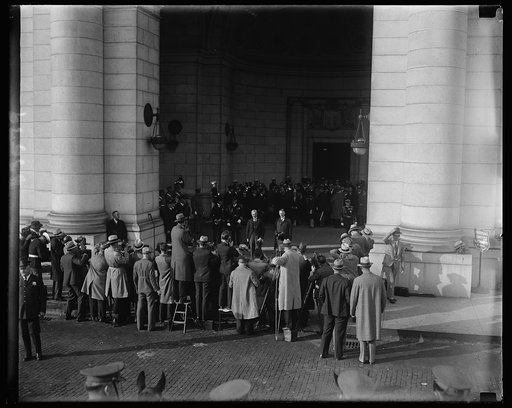 The battery of cameras. Here is the way the cameraman greeted Premier MacDonald at the Union Station, Washington, today upon his arrival to confer with President Hoover. This shot was made as the battery was "shooting" the Premier with Secretary of State Stimson