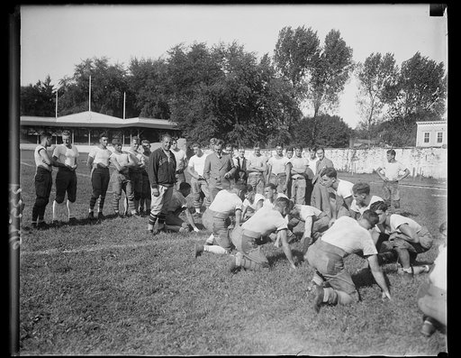 Famous Yale football coach looks over Georgetown U. Gridironers. Tad Jones, former Yale Coach and one of the leading football authorities in the country, looked over the Georgetown football team at practice today. Jones is shown on left in picture with Lou Little, Coach of the Georgetown team