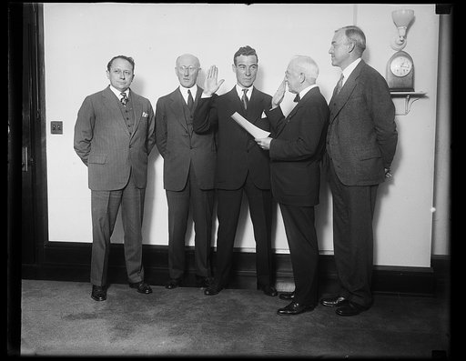 New Assistant Secretary of Commerce for Aeronautics takes oath of office. Clarence N. Young of Des Moines, Iowa, taking the oath of office today as Assistant Secretary of Commerce for Aeronatics, suceeding William P. MacCracken, Jr., resigned. In the photo left to right: Assistant Secretary of Comme