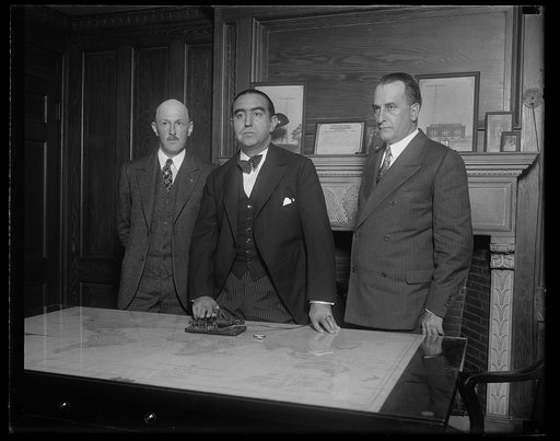 Direct Radio Telegraphic communication between the United States and Spain was officially opened at the offices of the R.C.A. Communications in Washington this morning. Mariano de Amoedo, charge d'affaires of the Spanish Embassy is shown pressing the telegraphic key opening the service. The King of 