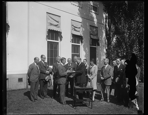 Herbert Hoover and group with cup outside White House, Washington, D.C.