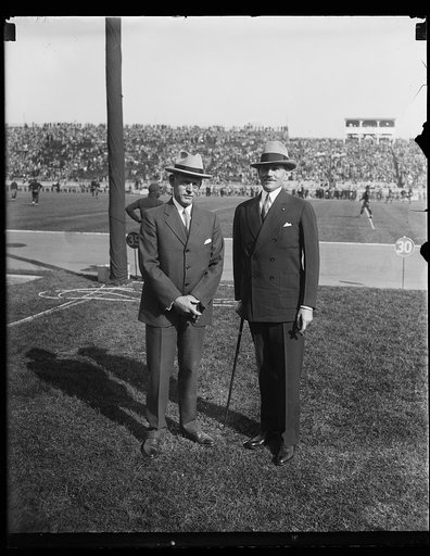 Patrick J. Hurley, right, at football game at stadium