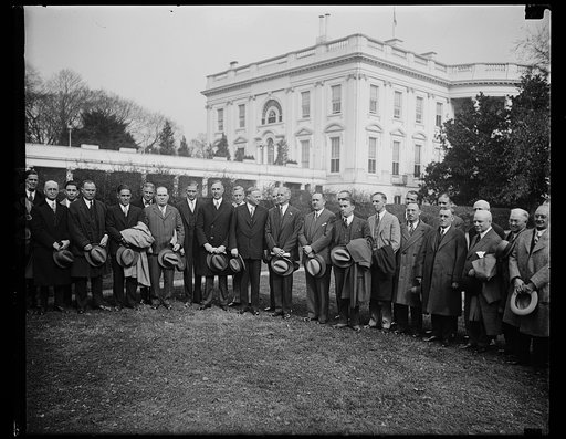 President Hoover greets New England export club. Members of the New England Export Club, who meeting in Washington at the Department of Commerce, were received by President Hoover today. In the center of group, left to right: W.L. Cooper, director, Foreign and Domestic Commerce, Department of Commer