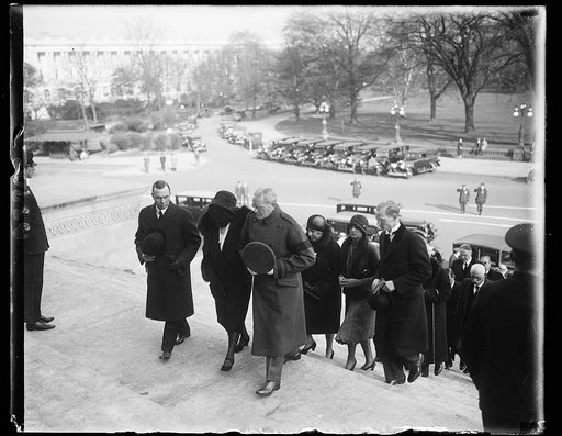 General Pershing and Mrs. Warren lead mourners at funeral of late Senator Warren. In the photograph, left to right: Francis E. Warren, Jr., son of the late Senator; Mrs. Francis E. Warren, the widow; General John J. Pershing; son of the late Senator; and Warren Pershing, grandson, as they followed t