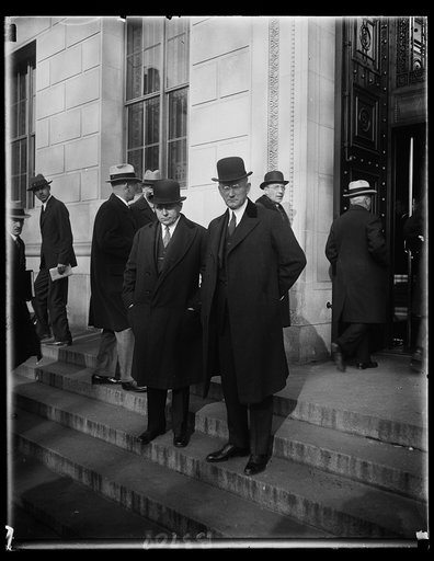 Secretary of Commerce Robert P. Lamont and Assistant Secretary Julius Klein (right) as they left the United States Chamber of Commerce today after attending the open session of the meeting of American business leaders called together by President Hoover