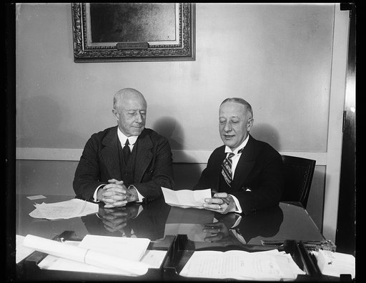 Al Smith call on Secretary of Navy. Former Governor Alfred E. Smith called on the Secretary of the Navy Charles Francis Adams today in Washington to ask for the help of Navy engineers in the construction of a mooring mast and landing platform for transatlantic dirigibles of the 1,100 foot tower of t
