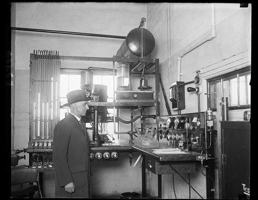 Air engine tester. Dr. K.C. Dickinson, Chief of the Heat and Power Division of the Bureau of Standards, and the control room of the new aircraft engine testing laboratory at Arlington, VA. Here all engines for use on licensed airplanes are to be tested and to protect the observer, the control room a