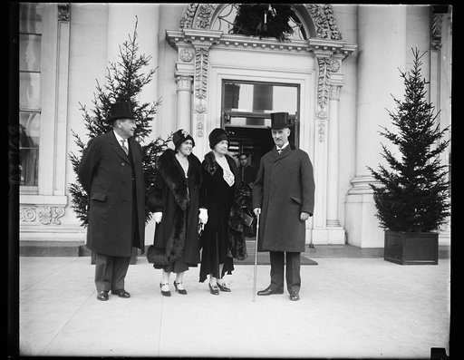 Justice Harlan F. Stone, Mrs. Stone, Mrs. Henry Lewis Stimson and Secretary of State Stimson as they appeared at the White House for the New Years reception