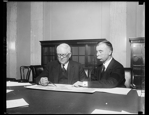 MacKay testifies in wire quiz. Senator James Couzens (left) of Michigan, Chairman of the Senate Interstate Commerce Committee and Clarence M. MacKay, President of the Postal Telegraph-Cable Company looking over a map in connection with the proposed Federal commission to regulate American communicati