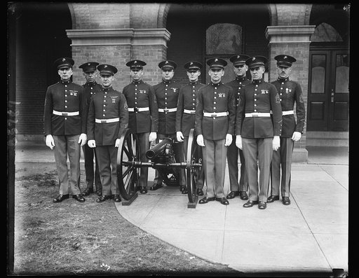 Conference couriers. These ten crack sergeants of the United States Marine Corps will act as couriers for the American delegation to the London Armament Conference. They are, left to right: Maddox and J.S. Domzaksi. Back row: (left to right) J.G.Mason, M.P.Clary, Charles W. Harriman, F.L. Brauer, J.