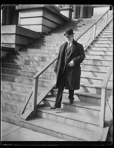 Charles Evans Hughes descending steps of State, War and Navy Building, Washington, D.C.