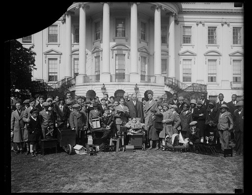 Two winners. Two winners of the National Committee on Wood Utilization proudly pose with President Hoover who suggested the plan when he was Secretary of Commerce. Left: Carl Bobzien, winner from Louisville, KY, President Hoover and Paul Quinn, winner from the District of Columbia [White House, Wash