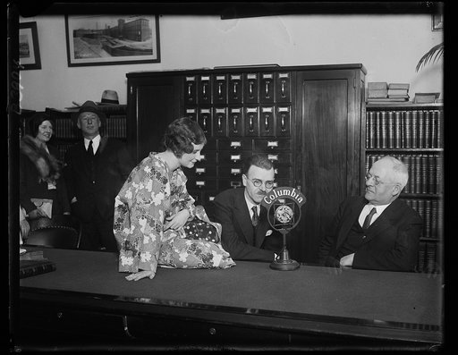 Solon loses on "Kimono" in spelling bee with newspaperman. Congressman Robert [...] of Massachusetts gets a practical demonstration of how we spell and wear kimono from one of his fair constituents, Miss Phylis Jensen of Auburndale, Massachusetts. The Massachusetts member tripped up on this word in 