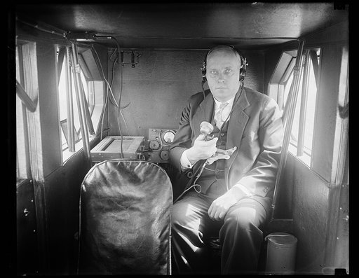 Government plane completely equipped for testing radio and lighting. Captain F.C. Hingsburg, Chief of the Airways Division of the United States Department of Commerce, and a Government airplane that has been completely oufitted as a flying laboratory for testing radio and lighting systems along the 